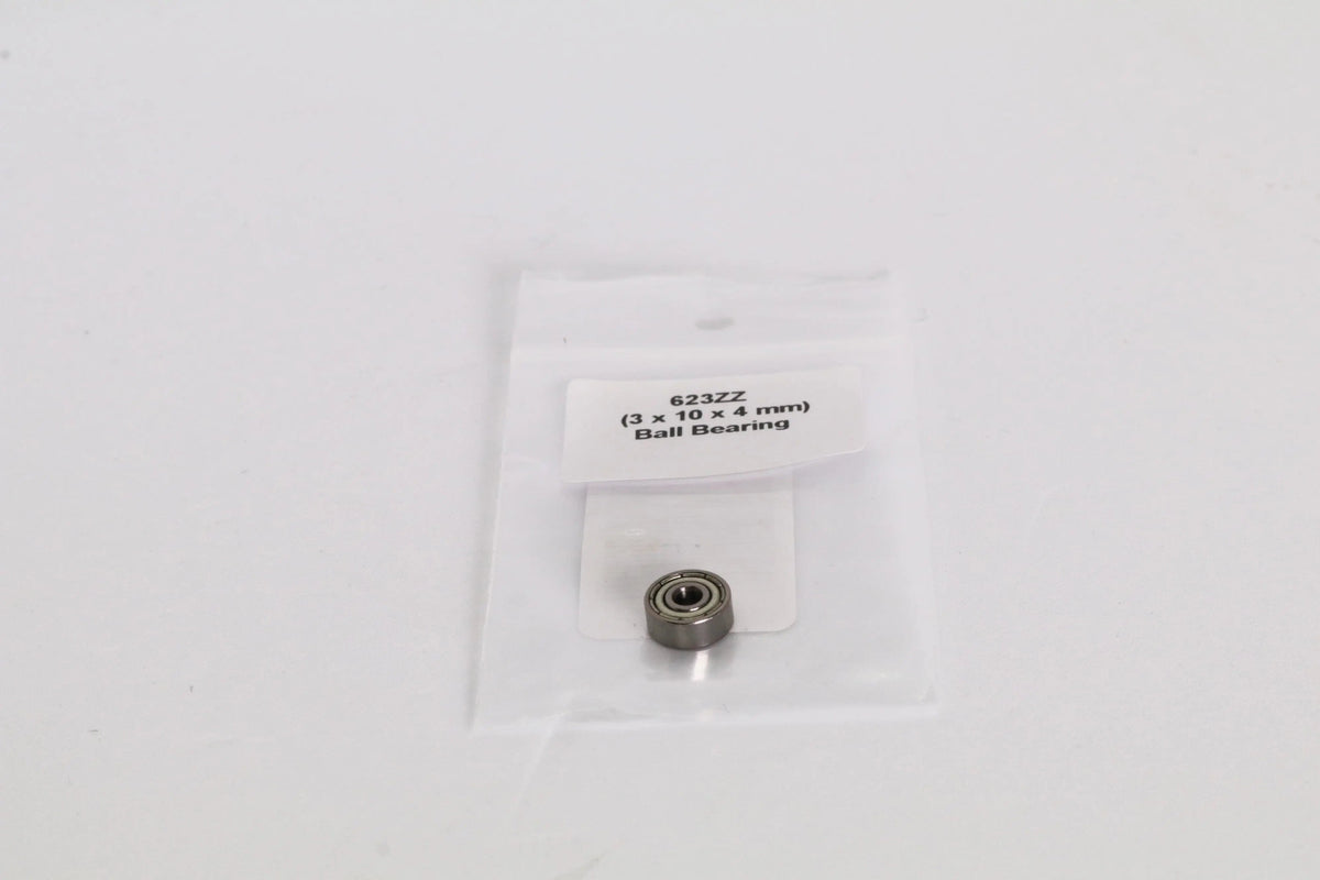 Petit roulement métallique dans un sachet plastique transparent, étiquette « 623ZZ (3 x 10 x 4 mm) Ball Bearing » visible