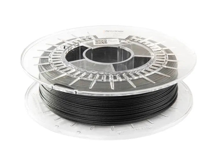 Bobine transparente de filament noir vue de trois quarts sur fond blanc