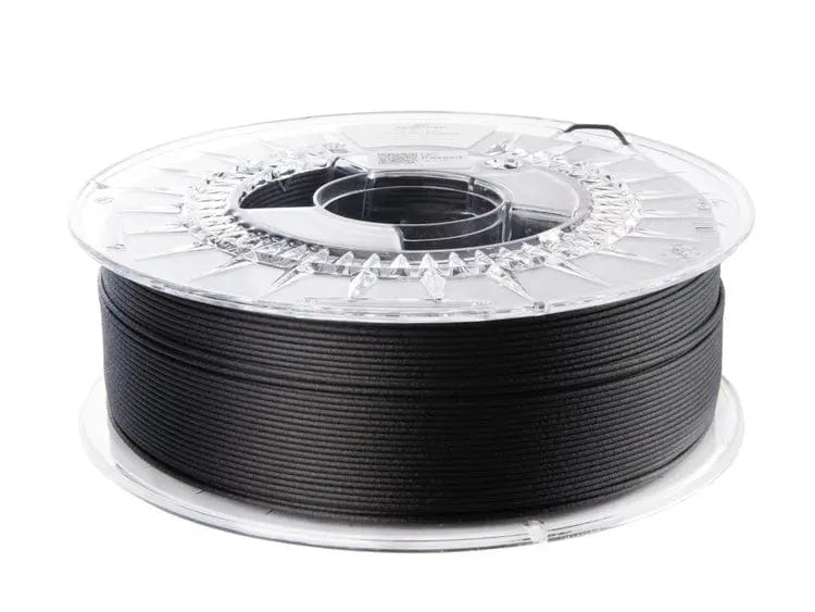 Bobine de filament noir enroulée sur une spool transparente, vue de trois quarts sur fond blanc
