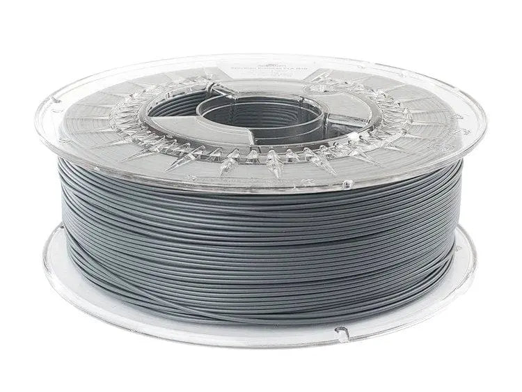 Bobine de filament gris foncé sur un support en plastique transparent, vue de côté sur fond blanc