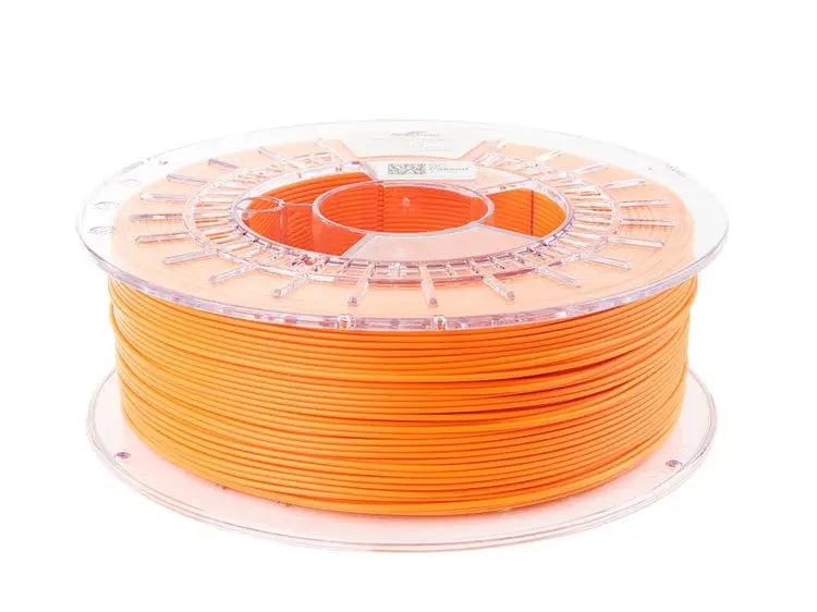 Bobine de filament orange translucide sur support plastique transparent, vue de face sur fond blanc