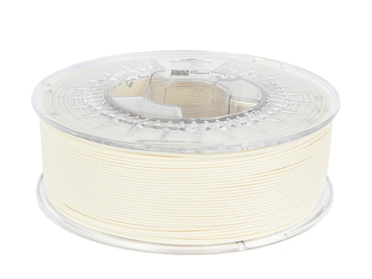 Bobine de filament beige translucide en gros plan, vue de côté, avec couvercle plastique transparent