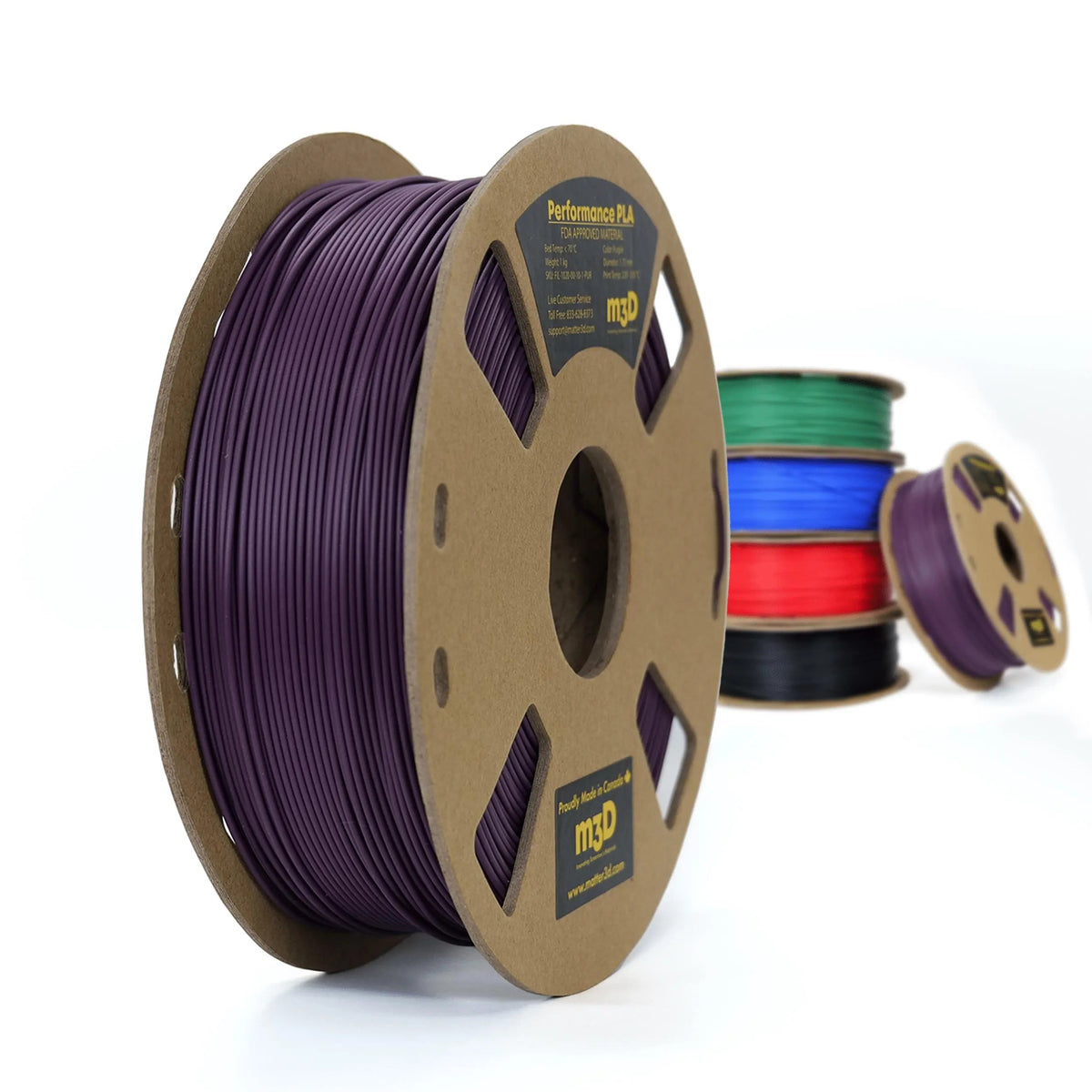 Grande bobine de filament violet au premier plan, avec plusieurs bobines colorées floues derrière