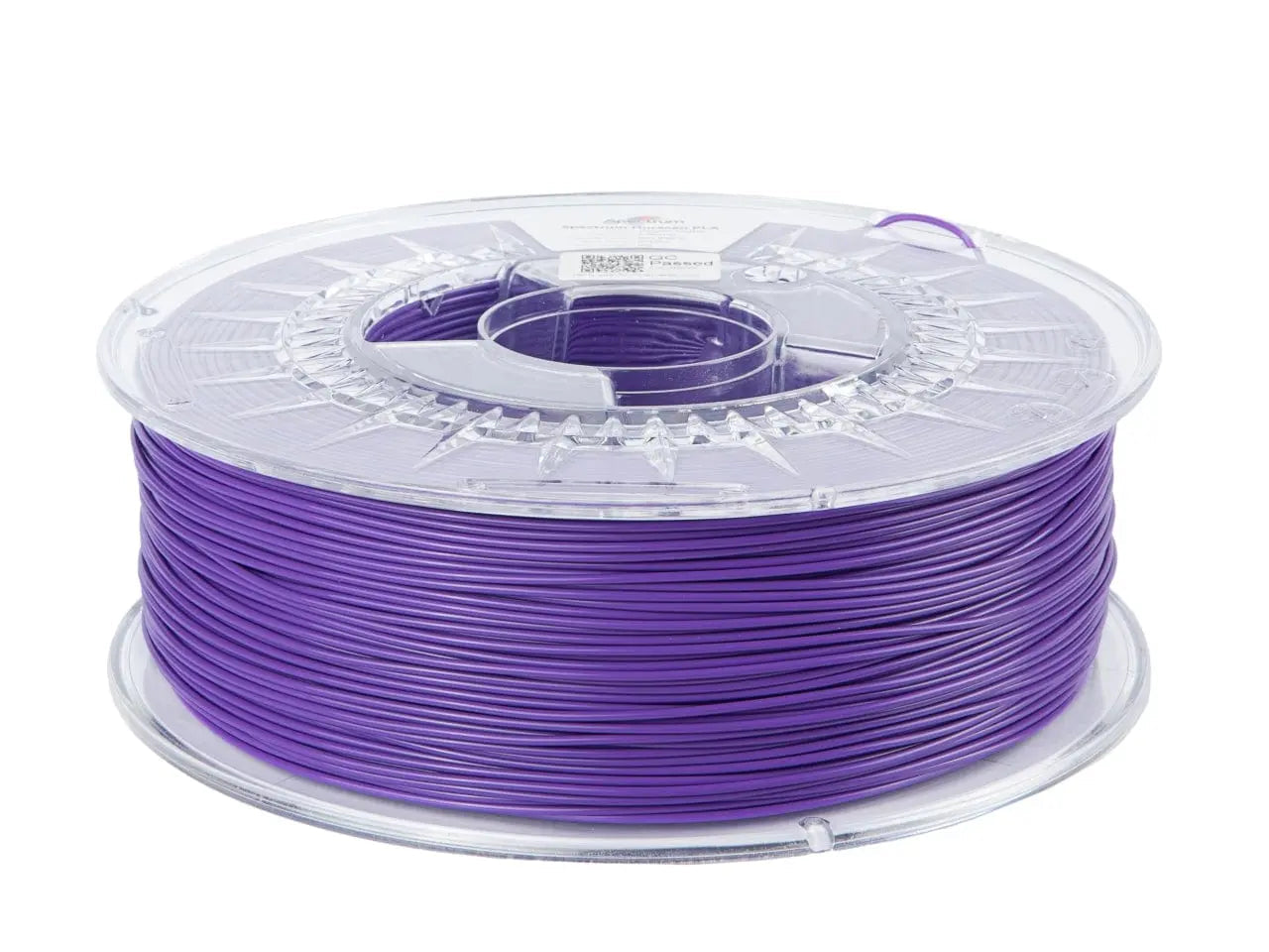Bobine de filament violet translucide, vue de côté avec enroulement visible et enrouleur clair