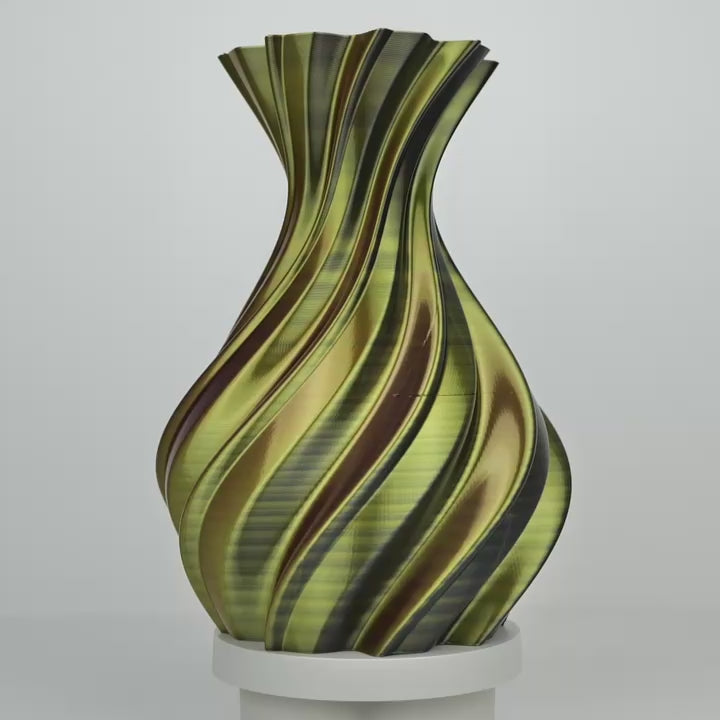 Vase imprimé en 3D rayé noir, or et violet sur un socle blanc