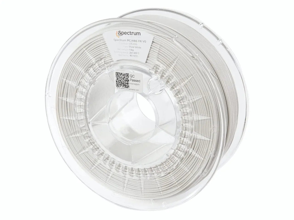 Bobine de filament blanc transparent en vue de face, avec l’étiquette Spectrum visible au centre