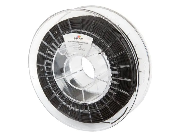 Bobine de filament noir dans une boîte plastique transparente, vue de face sur fond blanc