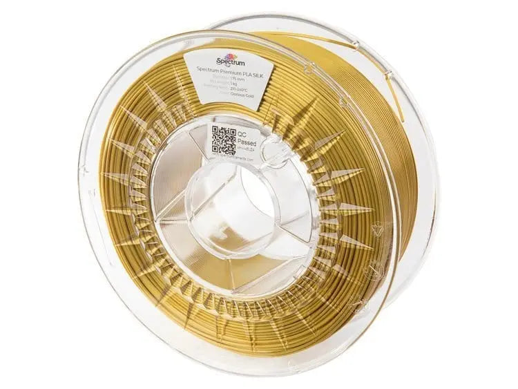Bobine transparente de filament doré enroulé, vue de face sur fond blanc avec étiquette Spectrum au centre